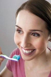 woman brushing teeth