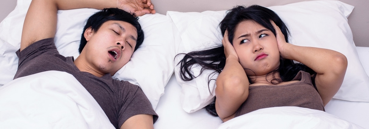 man snoring and girlfriend annoyed