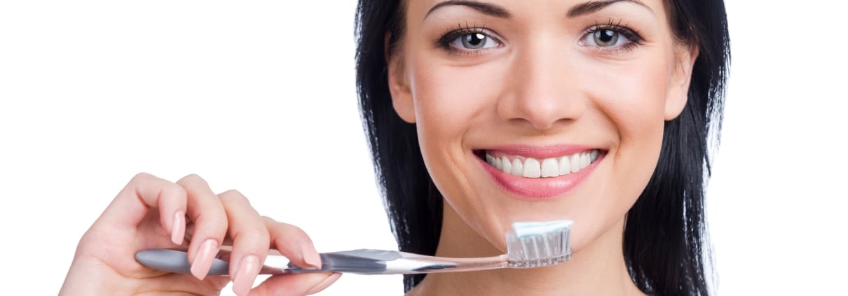 Woman holding a toothbrush