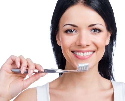 Woman holding a toothbrush