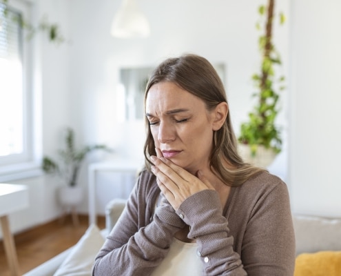 Woman in mouth pain