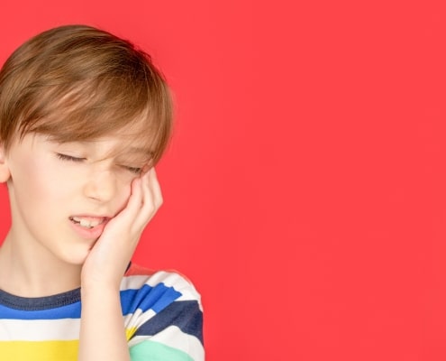 Young boy with a toothache