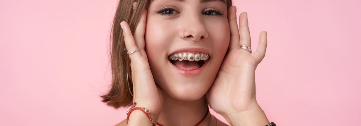 Young girl smiling with braces