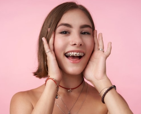 Young girl smiling with braces