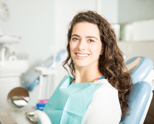 Young woman smiling at the dentist