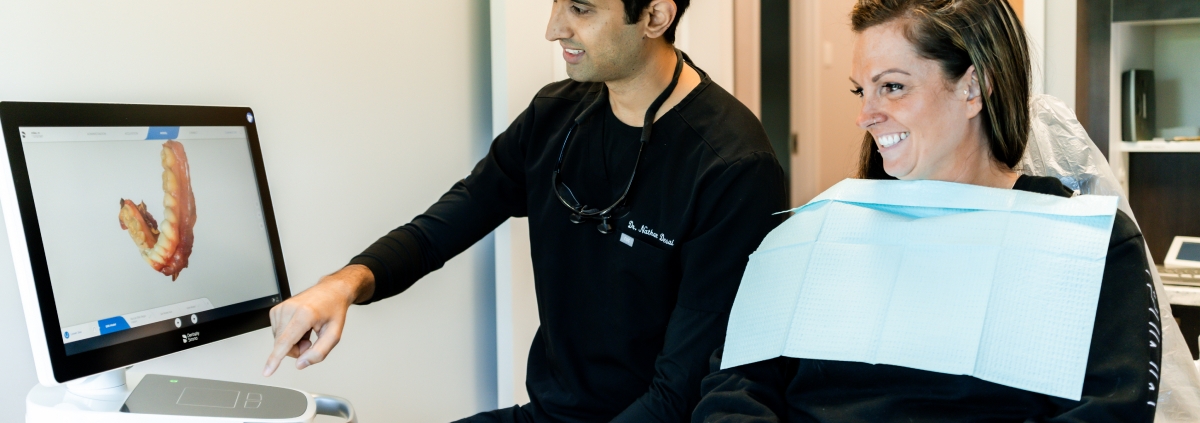 Dr. Desai showing the 3D view of the patient's bottom arch